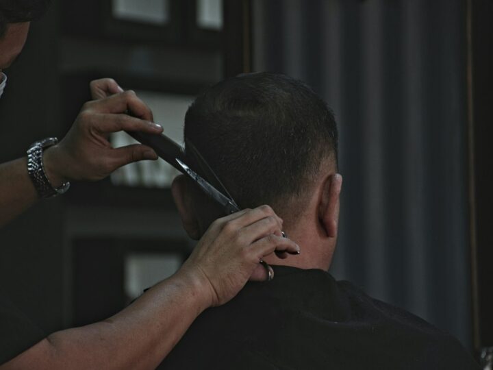 Man checking his haircut in the mirror