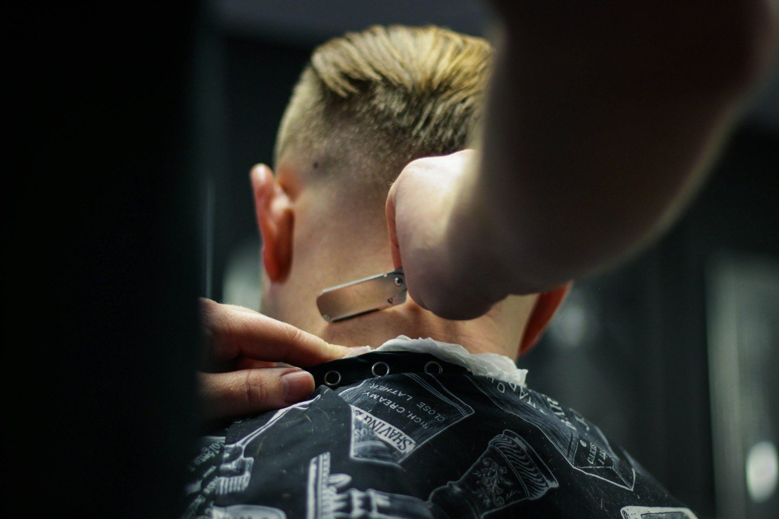 Boy getting a short haircut at the barber