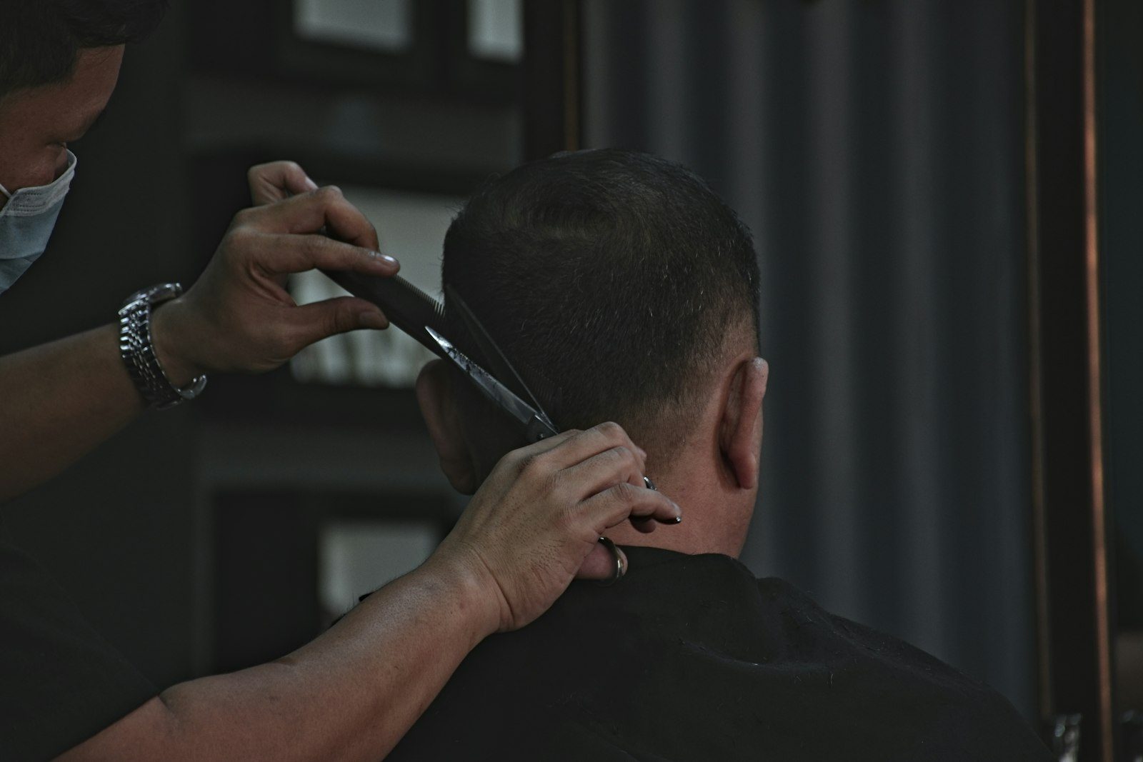 Man with a Caesar cut and short forward fringe