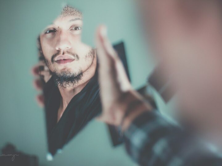 Man grooming at the mirror