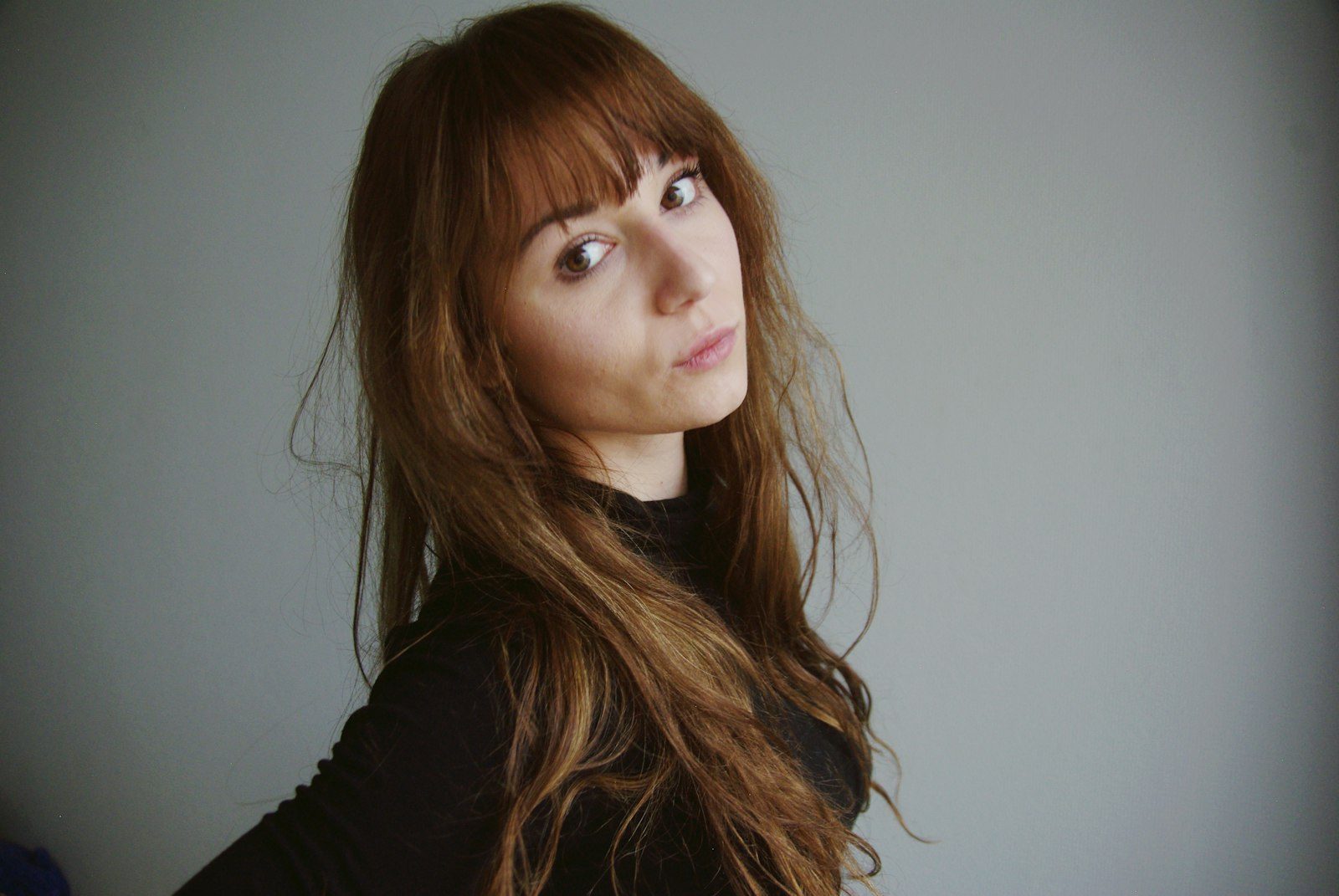 Curtain fringe hairstyle framing the face