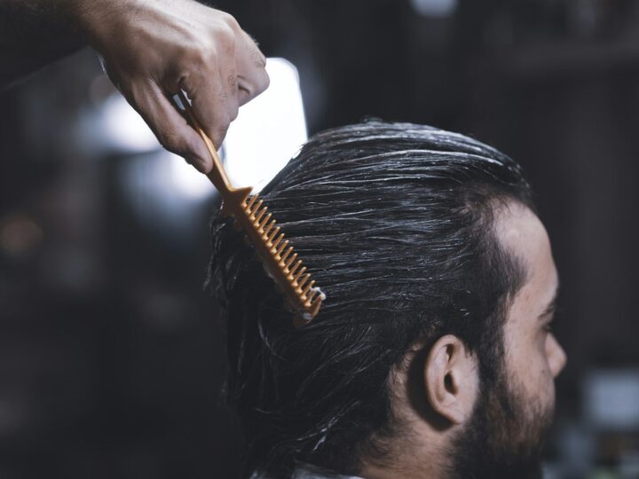 Man applying styling product