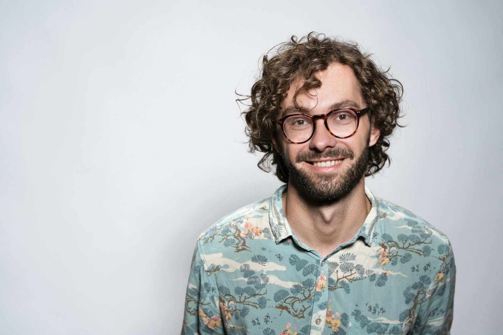 Man wearing glasses with a modern haircut