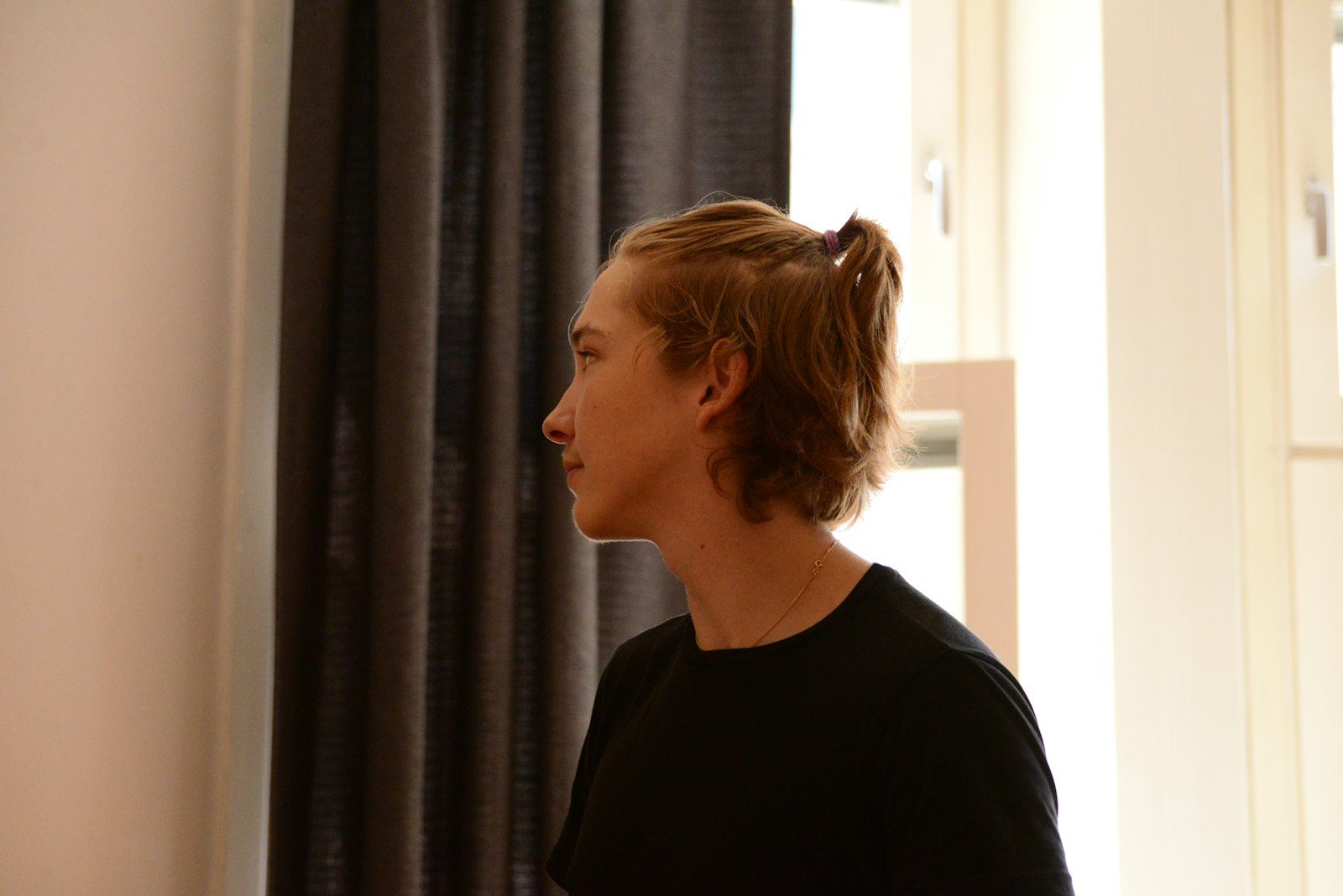Man with long hair in a man bun