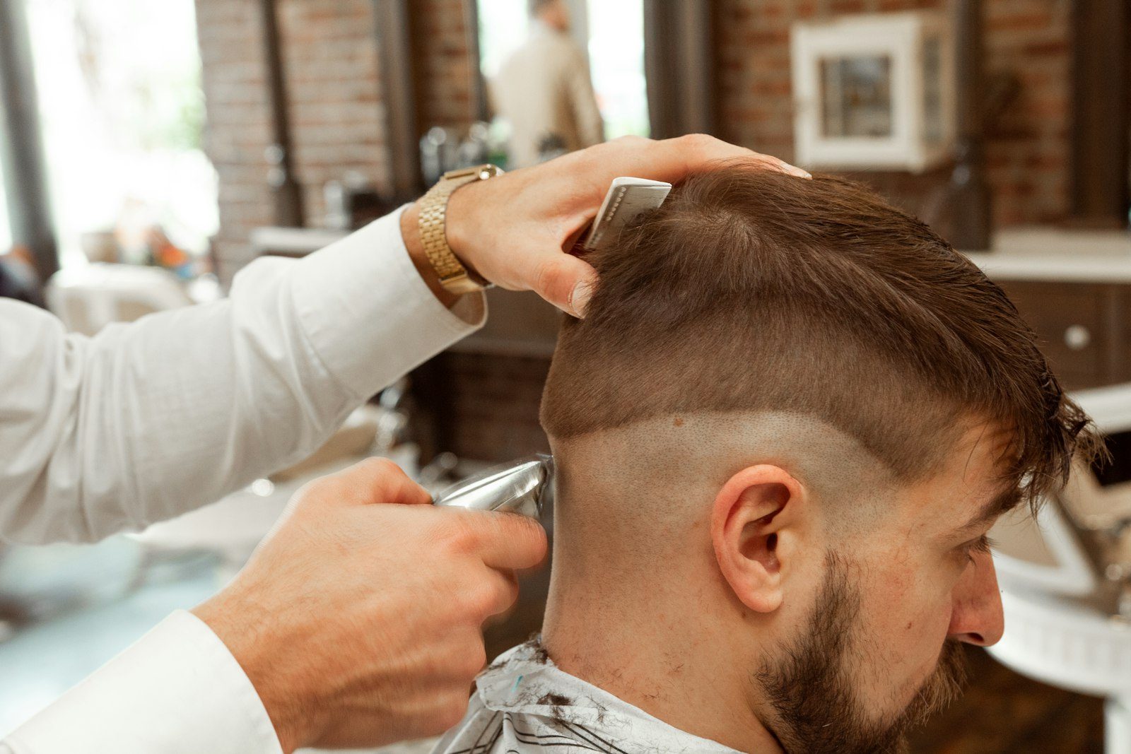 Man’s sideburns lined up by a barber